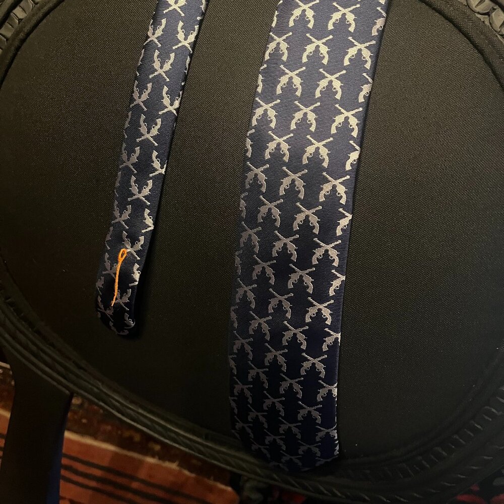 Artfully Disheveled Men's Navy Blue Tie with Silver Design revolvers